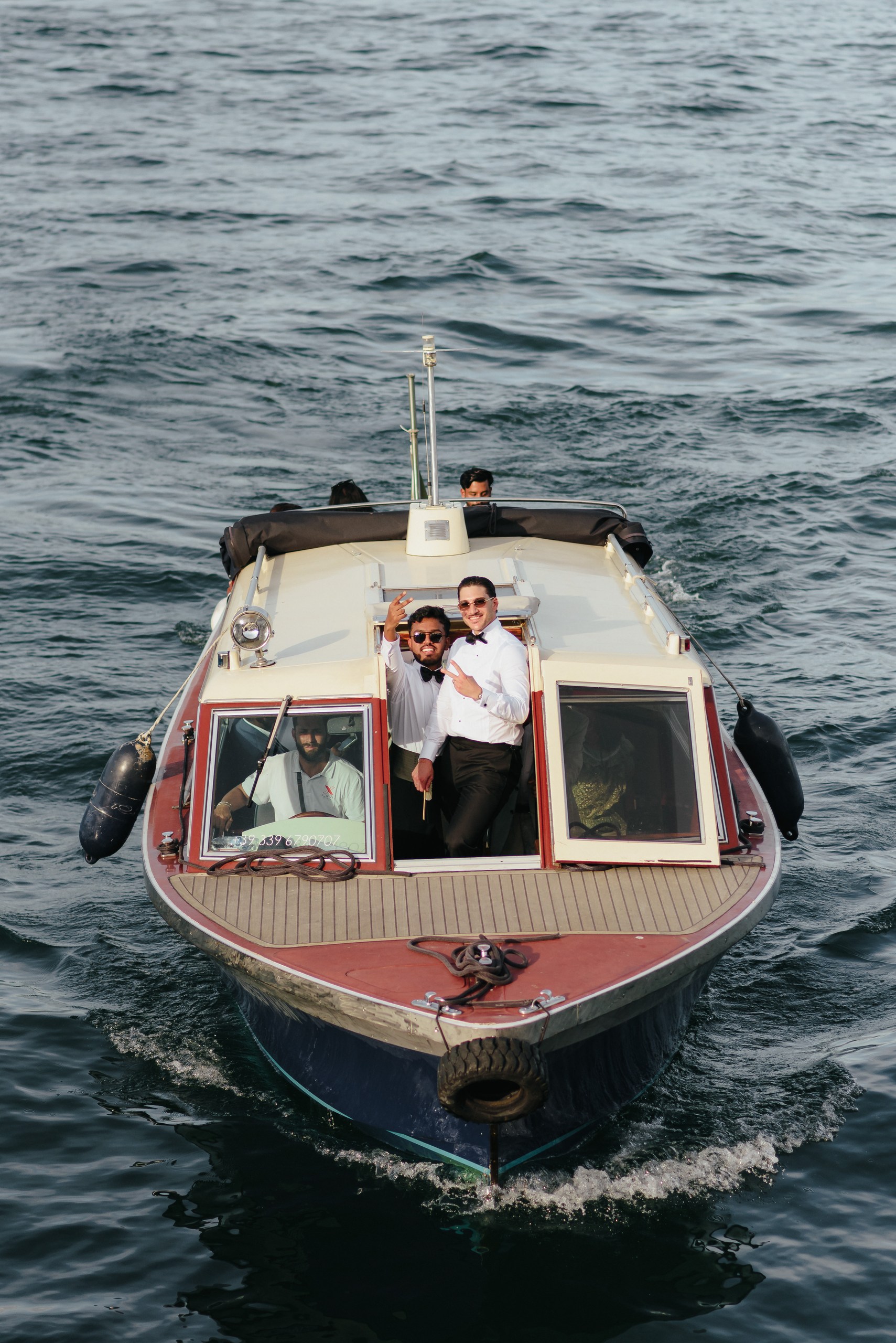 Wedding Boat Tour on Lake Maggiore Wedding guests enjoying a scenic boat tour on Lake Maggiore after the ceremony in Stresa.