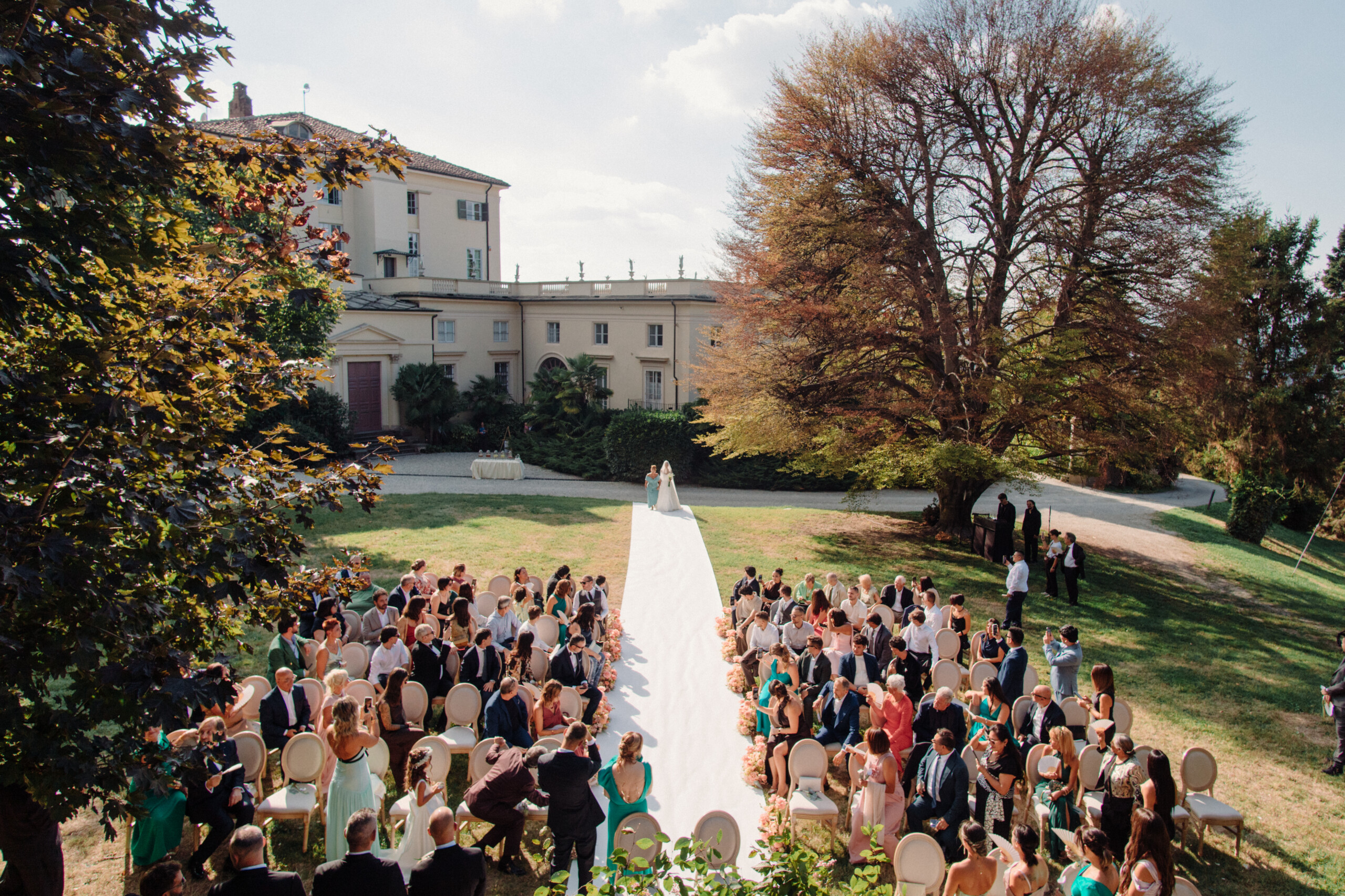 Outdoor Wedding Ceremony at Villa Cimena – Turin Aerial view of Giannella and Enrico's outdoor wedding ceremony in the gardens of Villa Cimena in Turin, Italy.
